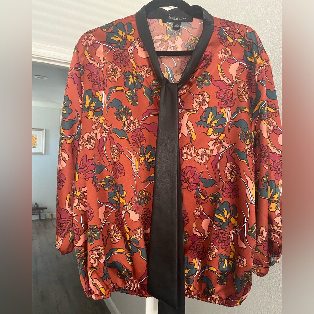 Women’s satin feeling blouse with faux leather tie